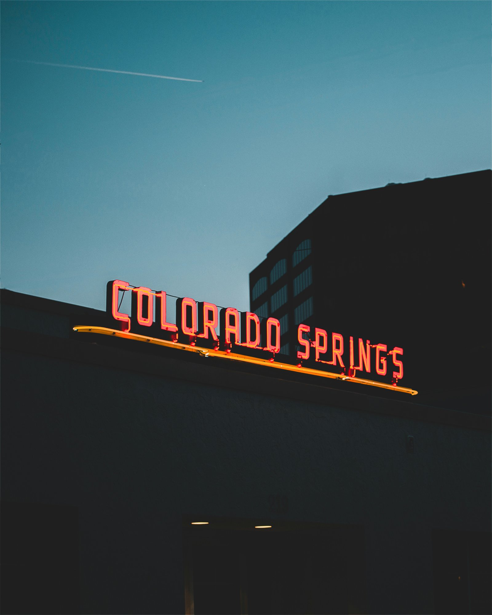 Colorado Springs neon sign at dusk